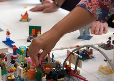 A student building with Legos